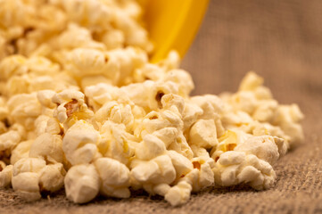 Popcorn scattered on the table and potato chips. Self-isolation in the covid-19 pandemic.