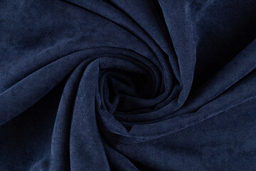curtain fabric canvas dark blue, rolled into a spiral