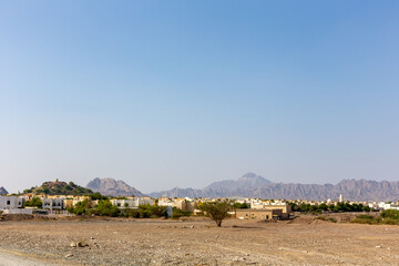 Hatta Town with residential buildings landscape, Hajar Mountains in the background. United Arab Emirates.