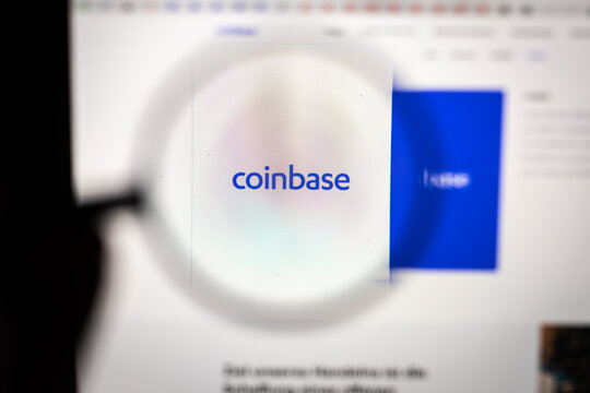 Coinbase logo on the coinbase website, enlarged through a magnifying glass