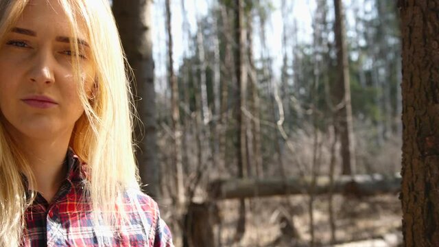 fragile girl lumberjack. Portrait of a girl in the forest 
