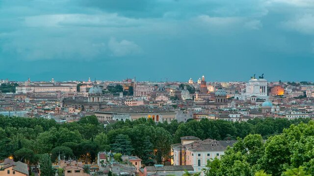 Panoramic aerial view of historic center day to night transition timelapse of Rome, Italy. Cityscape with heavy dramatic clouds after sunset