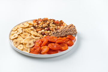 Natural, healthy sweets with a flat plate on a white background.