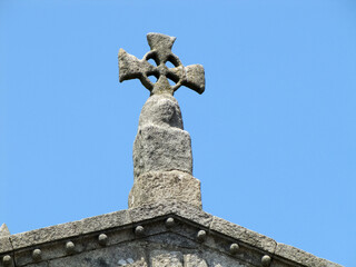 stone cross on the roof of the building. Porto Portugal.