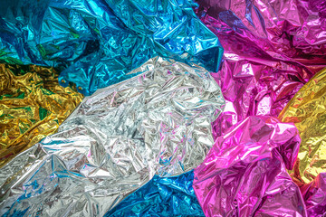 Background made of shiny multi-colored foil for congratulations