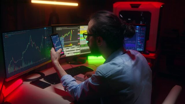 Computer and smartphone with  crypto coin trading chart on the screen. Trading on the cryptocurrency exchange. Professional stockbroker man cryptocurrency concept