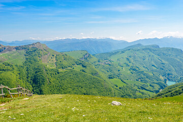 Fototapeta na wymiar Fragment of a nice mountain view Garda Lake from the trail at Monte Baldo in Italy.