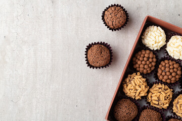 Typical brazilian brigadeiros, various flavors in a box with copy space
