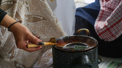 person holding a cup of tea