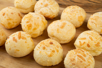 Typical brazilian cheese bun over a wooden board