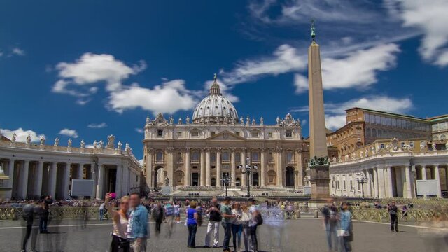 St.Peter's Square full of tourists with St.Peter's Basilica and the Egyptian obelisk within the Vatican City timelapse hyperlapse with tourists at summer day
