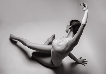 Beautiful dancer posing in studio. Woman dance contemporary. Black and white photography
