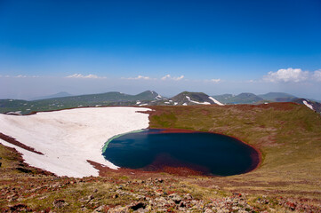 A beautiful crater lake on the summit of mount Azhdahak in Armenia - 428237951