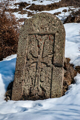 Traditional Armenian khachkar (cross stone) with typical Christian Armenian ornaments and patterns - 428237992