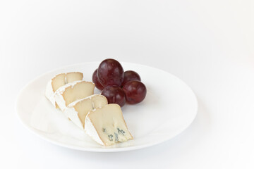 camembert or brie cheese isolated on white background, soft cheese covered with edible white mold view from above, gourmet blue cheese