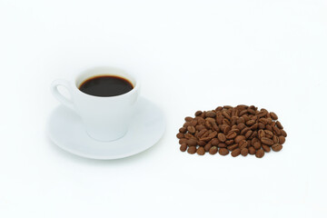 Ceramic coffee cup, many coffee beans isolated on white background