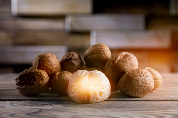 Walnuts like healthy food for the brain. Shape of human brain is surrounded by walnut kernels. It symbolizes how brain similarity with walnuts and proven effectiveness as healthy food for brain