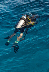 Tourists go diving during a cruise on the bay. Sea excursions to the reefs of the Red Sea.
