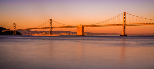Golden Gate Bridge in San Francisco Bay near Sunset.