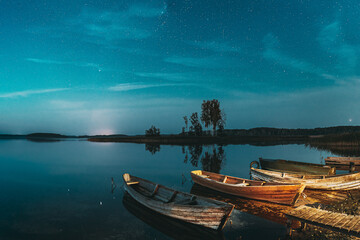 Real Starry Sky And Night Stars Above Lake. Natural Starry Sky Reflection Landscape .