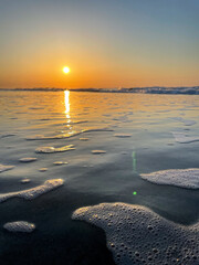 sunset over the sea waves