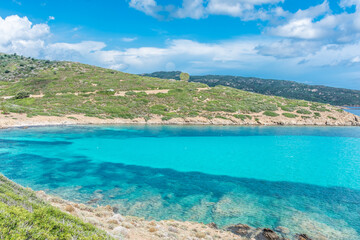 Fototapeta na wymiar Beautiful turquoise water of a bay in Asinara Island, Sardinia