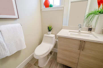 Fragment of luxury bathroom with a sink and wooden cabinet