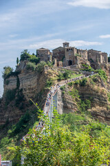 Fototapeta premium Civita di Bagnoregio, panoramic view of the dying city on a rock, and the canyon around the mountain. stock photo.Civita Di Bagnoregio, Europe, Italy, Lazio.