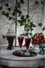 Grape juice in a glass on the table.