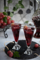 Grape juice in a glass on the table.