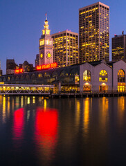 Fototapeta na wymiar City of San Francisco skyline at night with lights reflected in San Francisco Bay.