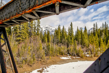 Views along a repurposed railway bridge over Bow River in Canmore Alberta