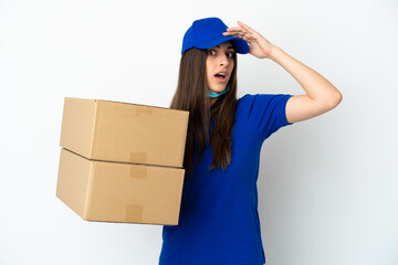 Delivery caucasian woman isolated on white background doing surprise gesture while looking to the side