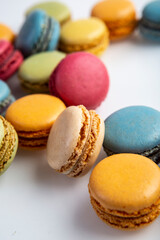 Fototapeta na wymiar Composition of multicolored macaroon on a white background