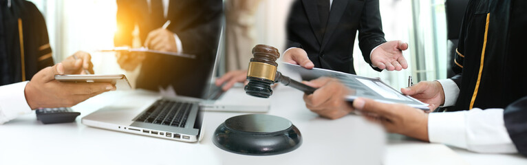 Male lawyer or judge wearing  protective mask on the consult having team meeting with client, Law and Legal services concept