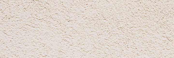Texture of an old painted wall. Rough surface of the plastered and colored wall. Wide panoramic texture for background and design.