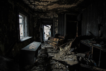 Fototapeta na wymiar Burnt old house interior. Consequences of fire