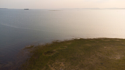 Coast and reservoir with sun light, Aerial photo and Little noise.