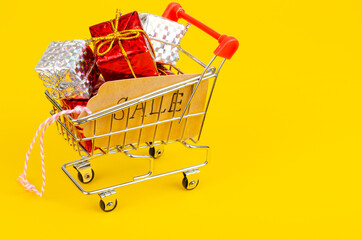 Seasonal sales. Shopping cart shopping cart on bright background