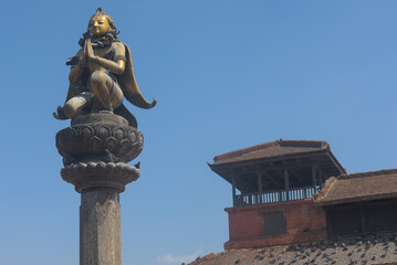 statue on the stone pillar 