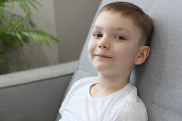 Candid Portrait of Smiling Boy at Home