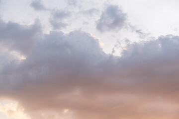 Pink and blue summer sky with big clouds