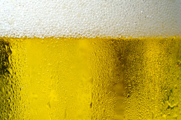 Background Cool beers with beer bubbles on top a glass at the party