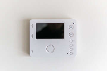 white video intercom on the wall in the apartment