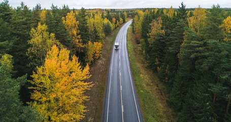 Truck on a autumn color road 01