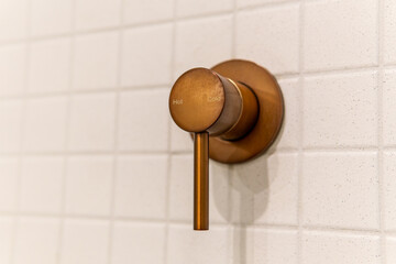 Hot and cold modern chrome shower handle valve in bathroom wall