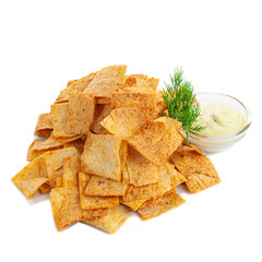 Homemade cornmeal nachos chips with paprika. With garlic sauce and herbs. Beer snack. White background. Isolated. Close-up.