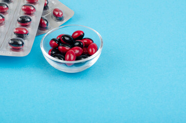 Bicolor medical pills on bright background. Photo