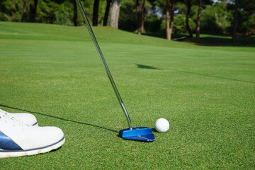 Golf ball on green natural grass
