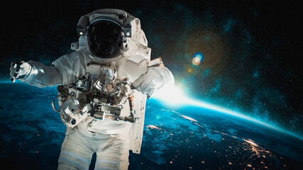 Plakat Astronaut spaceman do spacewalk while working for space station in outer space . Astronaut wear full spacesuit for space operation . Elements of this image furnished by NASA space astronaut photos.